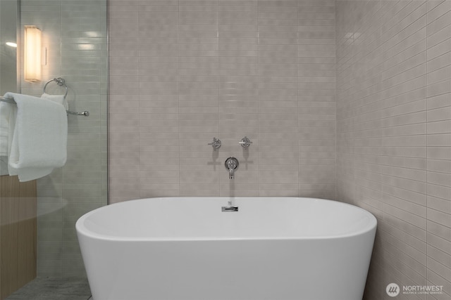 238 4th Ave Unit 101, Kirkland, WA 98033 - full bathroom with a soaking tub and tile walls