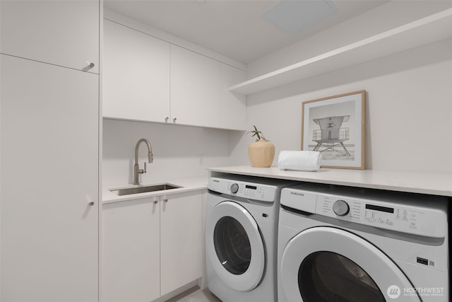 238 4th Ave Unit 101, Kirkland, WA 98033 - washroom featuring independent washer and dryer and cabinet space