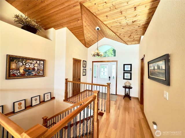 441 N Potlatch Dr N, Hoodsport, WA 98548 - corridor with an upstairs landing, wooden ceiling, light wood finished floors, high vaulted ceiling, and baseboards