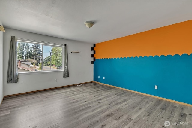 9201 S G St, Tacoma, WA 98444 - spare room with wood finished floors and baseboards