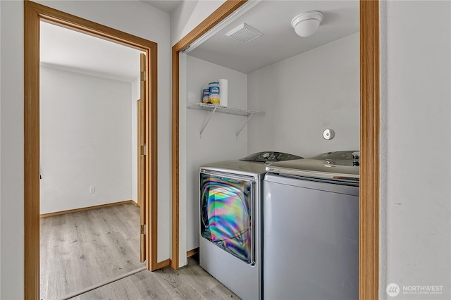 9201 S G St, Tacoma, WA 98444 - laundry room with washer and clothes dryer and light wood-type flooring