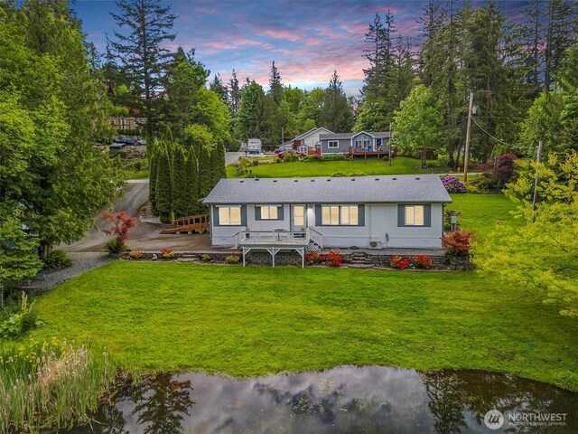 495 Lakeside Dr, Sedro Woolley, WA 98284 - rear view of house with a yard, view of scattered trees, and stairs