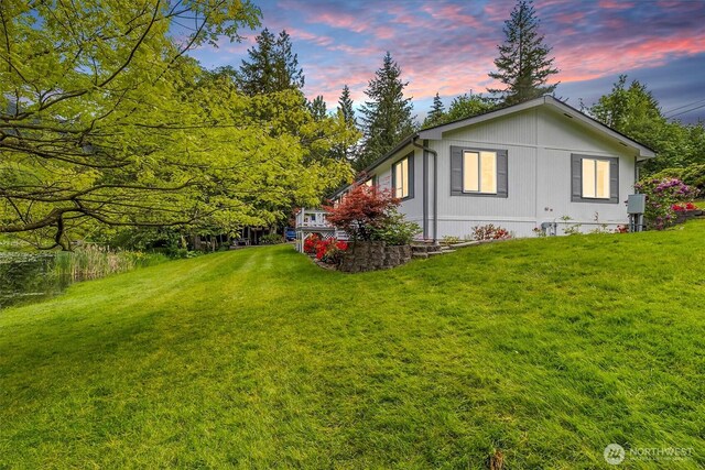 495 Lakeside Dr, Sedro Woolley, WA 98284 - property exterior at dusk featuring a lawn