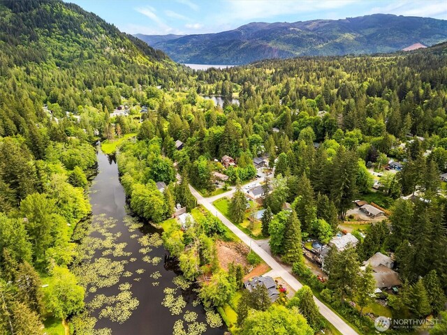 495 Lakeside Dr, Sedro Woolley, WA 98284 - drone / aerial view of a heavily wooded area and a water and mountain view
