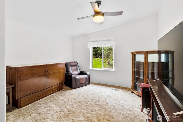 495 Lakeside Dr, Sedro Woolley, WA 98284 - living area with vaulted ceiling, carpet floors, a ceiling fan, and baseboards