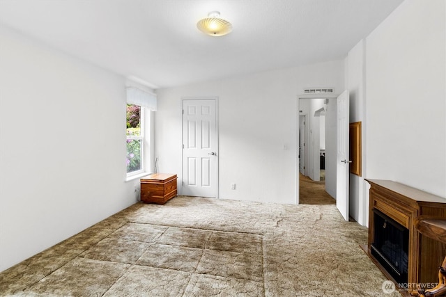 495 Lakeside Dr, Sedro Woolley, WA 98284 - unfurnished bedroom featuring carpet floors and a fireplace