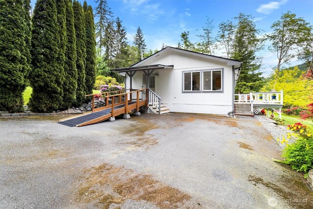495 Lakeside Dr, Sedro Woolley, WA 98284 - rear view of property with a wooden deck