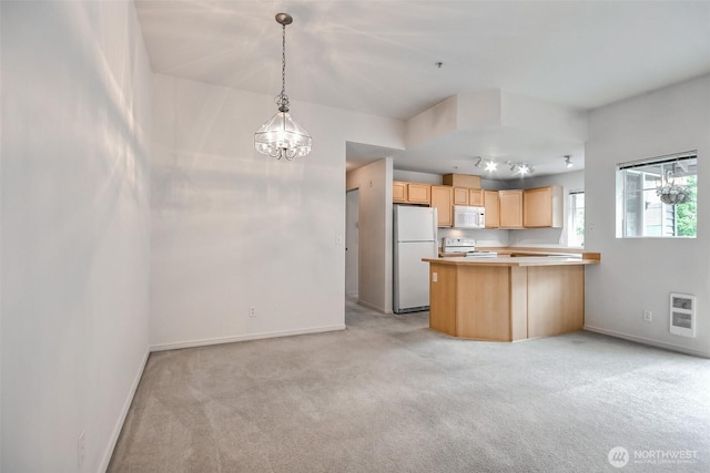 15325 SE 155th Pl Unit N5, Renton, WA 98058 - kitchen with white appliances, light carpet, light brown cabinetry, baseboards, and a chandelier