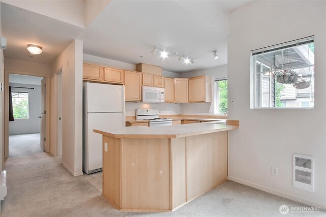 15325 SE 155th Pl Unit N5, Renton, WA 98058 - kitchen with white appliances, light brown cabinetry, light carpet, light countertops, and healthy amount of natural light