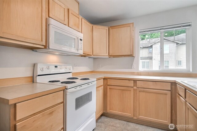 15325 SE 155th Pl Unit N5, Renton, WA 98058 - kitchen with white appliances, light brown cabinets, and light countertops
