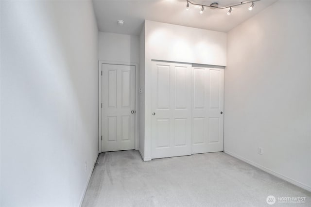15325 SE 155th Pl Unit N5, Renton, WA 98058 - unfurnished bedroom featuring light carpet, baseboards, and a closet