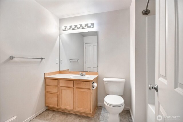 15325 SE 155th Pl Unit N5, Renton, WA 98058 - bathroom featuring toilet, vanity, and baseboards