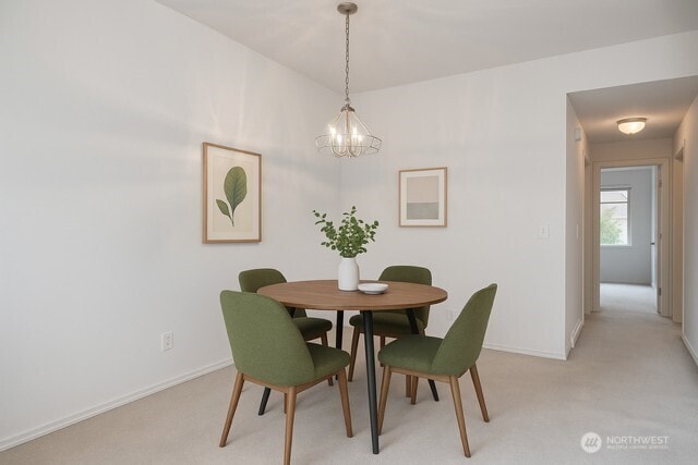 15325 SE 155th Pl Unit N5, Renton, WA 98058 - dining room with a chandelier, baseboards, and light carpet