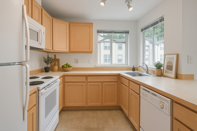 15325 SE 155th Pl Unit N5, Renton, WA 98058 - kitchen featuring white appliances, a sink, light brown cabinets, light countertops, and light tile patterned floors