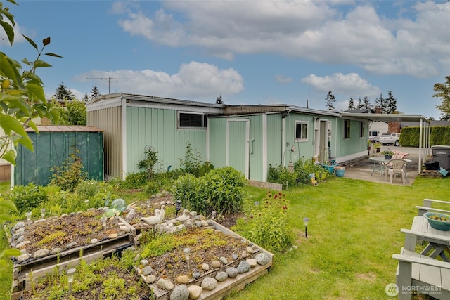 18501 52nd Ave W Unit 44, Lynnwood, WA 98037 - back of house featuring a patio area, a yard, and a carport