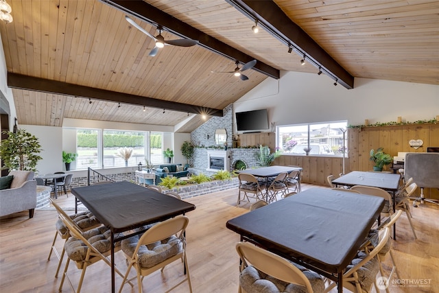 18501 52nd Ave W Unit 44, Lynnwood, WA 98037 - dining space featuring track lighting, a fireplace, light wood-style flooring, wood ceiling, and ceiling fan