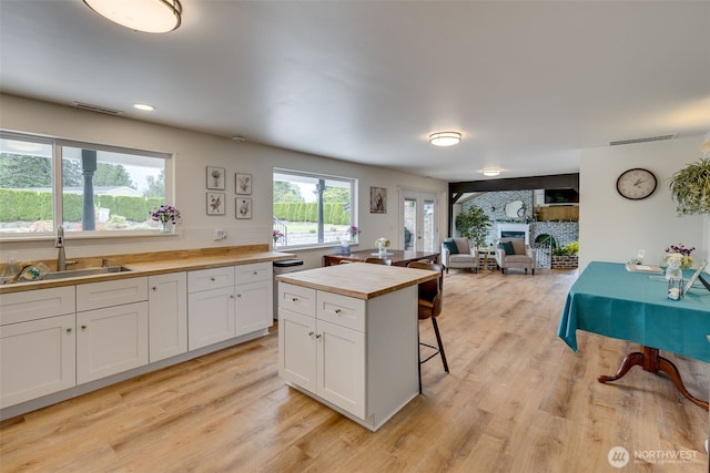 18501 52nd Ave W Unit 44, Lynnwood, WA 98037 - kitchen with wood counters, a sink, open floor plan, and light wood-type flooring