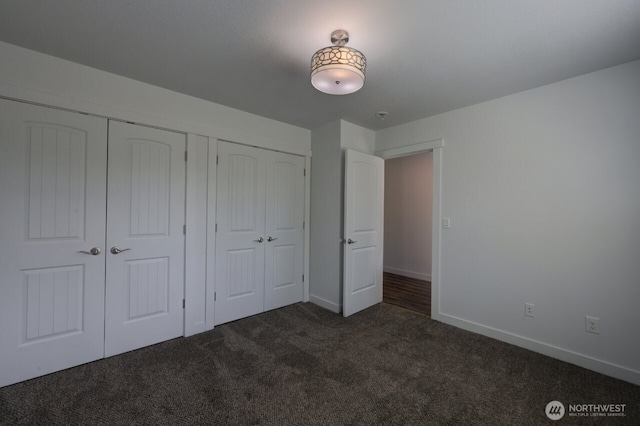 2201 303rd Pl, Ocean Park, WA 98640 - unfurnished bedroom featuring dark colored carpet and baseboards