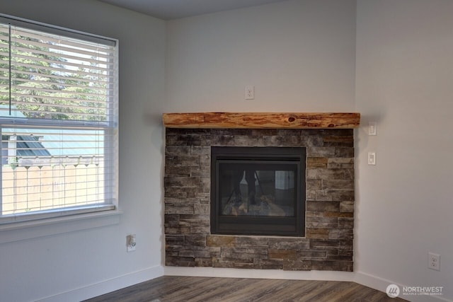 2201 303rd Pl, Ocean Park, WA 98640 - detailed view of wood finished floors, baseboards, and a stone fireplace