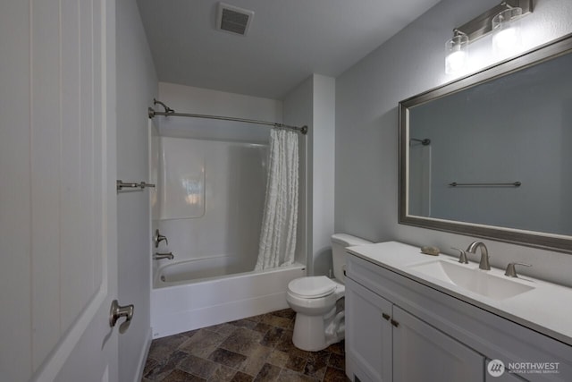 2201 303rd Pl, Ocean Park, WA 98640 - full bathroom featuring stone finish flooring, toilet, vanity, and shower / bath combo