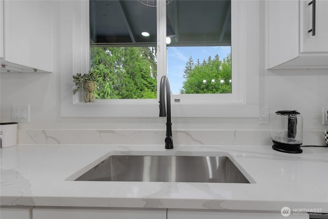 6808 4th Way SE, Lacey, WA 98503 - kitchen view of a sink, white cabinetry, and light stone countertops