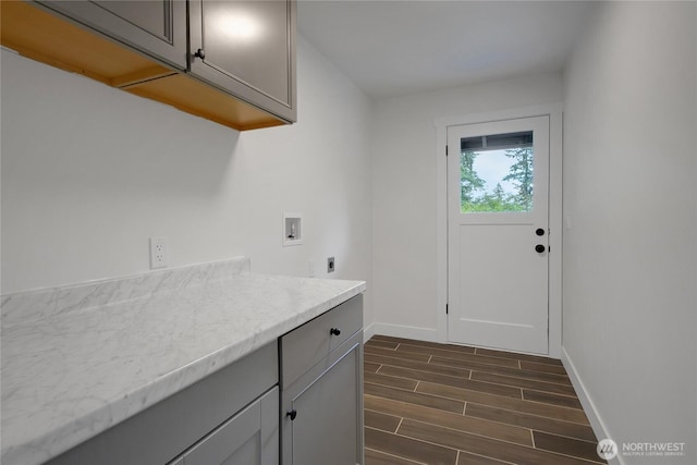 6808 4th Way SE, Lacey, WA 98503 - laundry room with hookup for an electric dryer, hookup for a washing machine, cabinet space, baseboards, and dark wood finished floors