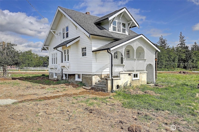27120 36th Ave NW, Stanwood, WA 98292 - view of side of property with a shingled roof, a porch, and a chimney