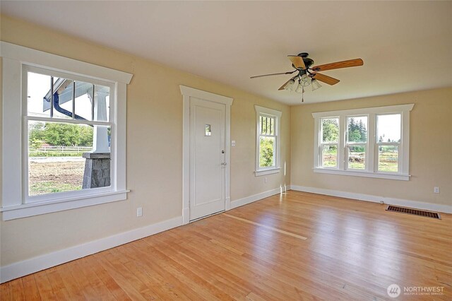 27120 36th Ave NW, Stanwood, WA 98292 - entryway with baseboards, light wood-style floors, and a ceiling fan