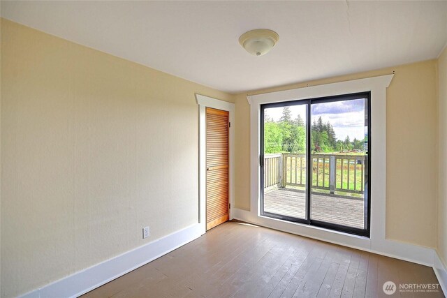 27120 36th Ave NW, Stanwood, WA 98292 - unfurnished room featuring baseboards and hardwood / wood-style floors