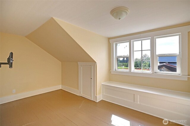 27120 36th Ave NW, Stanwood, WA 98292 - bonus room featuring hardwood / wood-style floors, vaulted ceiling, and baseboards