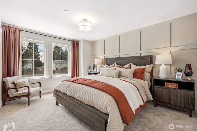 12119 127th Avenue Ct E Unit 94, Puyallup, WA 98374 - bedroom featuring light carpet and a decorative wall