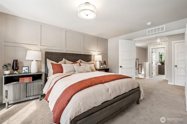 12119 127th Avenue Ct E Unit 94, Puyallup, WA 98374 - bedroom featuring a decorative wall and light carpet