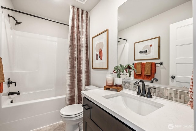 12119 127th Avenue Ct E Unit 94, Puyallup, WA 98374 - bathroom featuring toilet, shower / bath combo, tasteful backsplash, and vanity