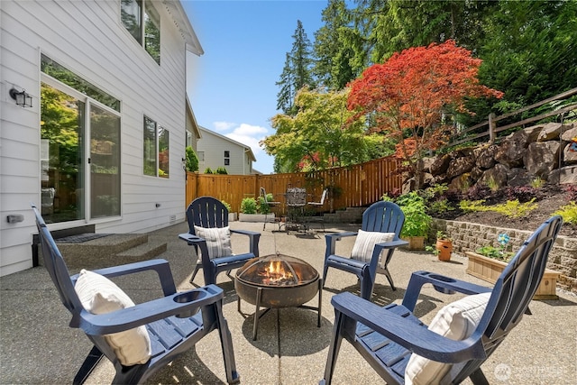 11226 Borgen Loop, Gig Harbor, WA 98332 - view of patio with an outdoor fire pit