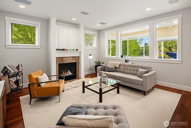 5102 S Frontenac St, Seattle, WA 98118 - living room featuring healthy amount of natural light, baseboards, wood finished floors, a tiled fireplace, and recessed lighting