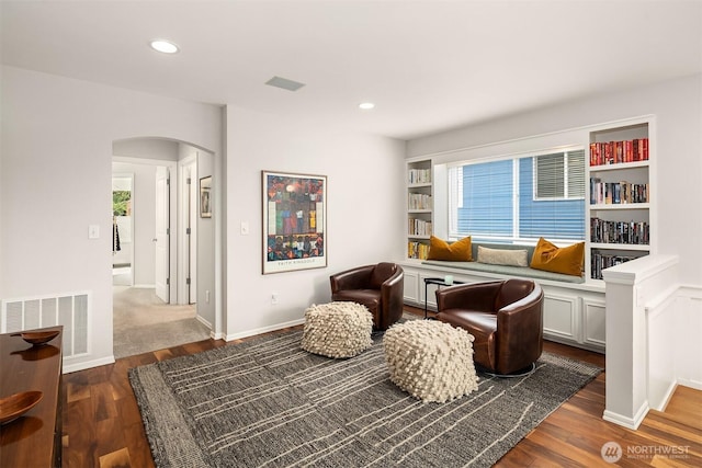 5102 S Frontenac St, Seattle, WA 98118 - sitting room featuring arched walkways, plenty of natural light, dark wood finished floors, and recessed lighting