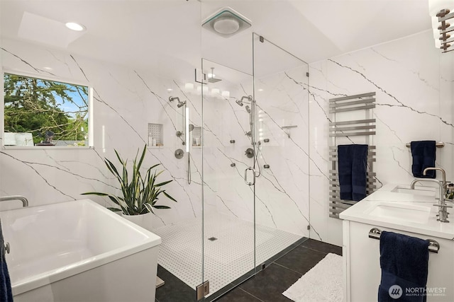 5102 S Frontenac St, Seattle, WA 98118 - full bath featuring a marble finish shower, a towel warmer, tile walls, a soaking tub, and double vanity