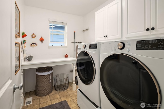 5102 S Frontenac St, Seattle, WA 98118 - laundry area featuring cabinet space, washing machine and dryer, and baseboards