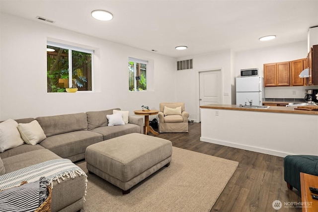 5102 S Frontenac St, Seattle, WA 98118 - living room featuring dark wood finished floors and recessed lighting