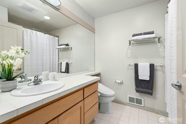 225 4th Ave Unit A307, Kirkland, WA 98033 - full bathroom with vanity, toilet, and baseboards