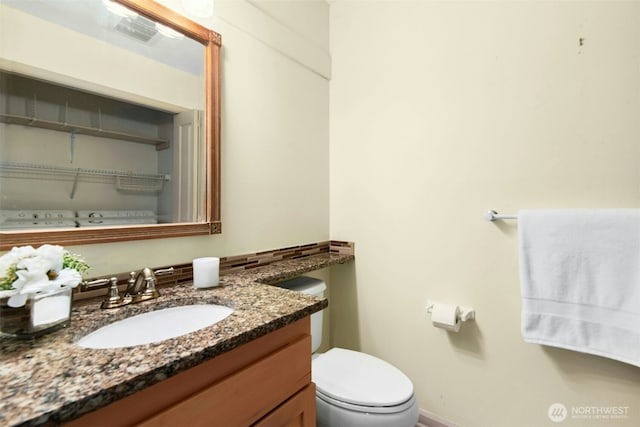 225 4th Ave Unit A307, Kirkland, WA 98033 - half bathroom with vanity, toilet, and baseboards