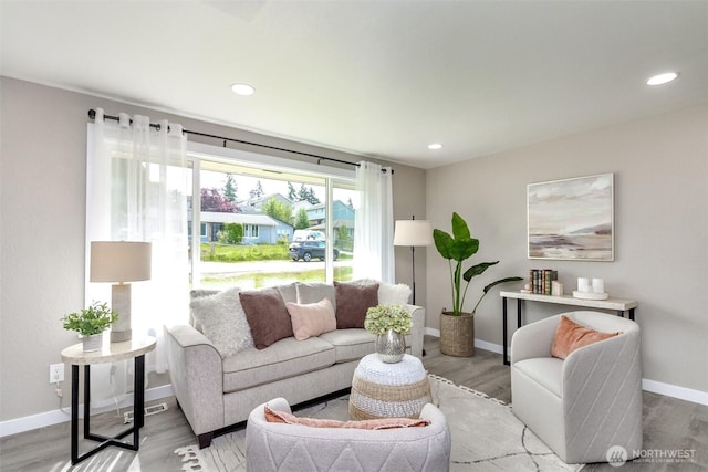 17801 111th Ave SE, Renton, WA 98055 - living room with wood finished floors, baseboards, and recessed lighting