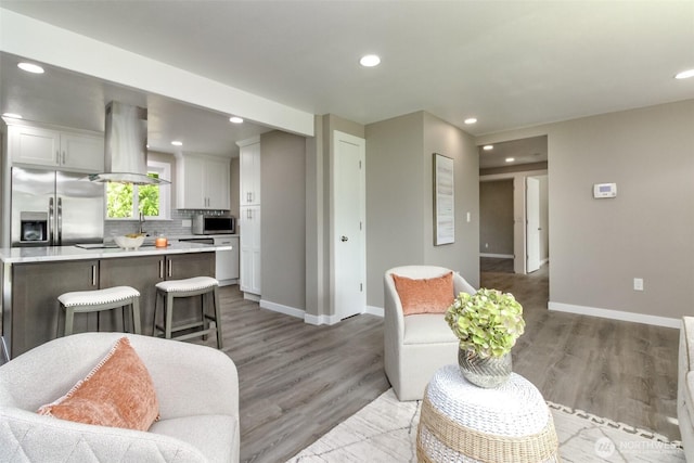 17801 111th Ave SE, Renton, WA 98055 - living area with baseboards, light wood-style floors, and recessed lighting