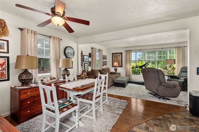 1656 Bishop Rd, Chehalis, WA 98532 - dining area with healthy amount of natural light, a textured ceiling, ceiling fan, and wood finished floors