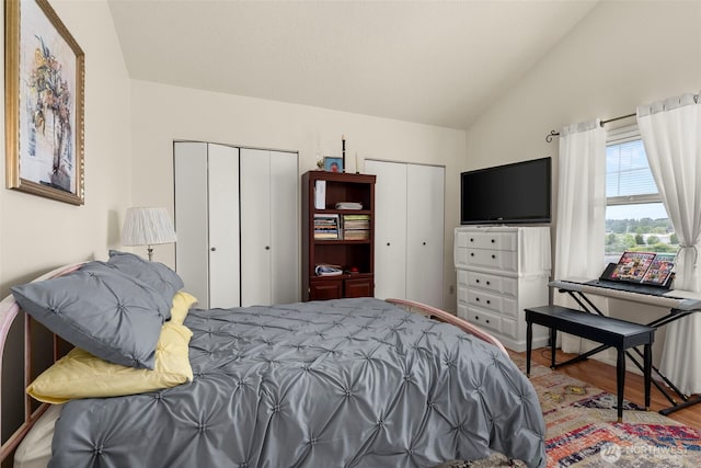 1656 Bishop Rd, Chehalis, WA 98532 - bedroom featuring two closets, wood finished floors, and vaulted ceiling