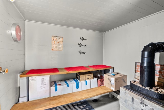 1656 Bishop Rd, Chehalis, WA 98532 - miscellaneous room featuring a wood stove, concrete flooring, and wooden ceiling