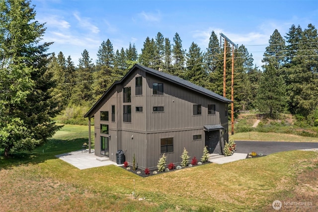 91 Pebble Beach Dr, Cle Elum, WA 98922 - view of home's exterior with a lawn, a patio, central air condition unit, and driveway