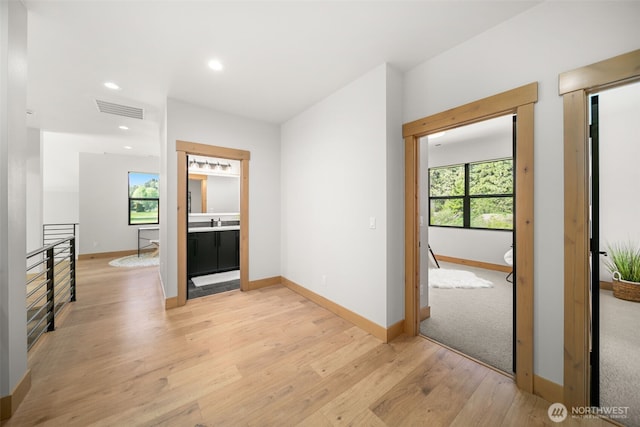 91 Pebble Beach Dr, Cle Elum, WA 98922 - hallway featuring baseboards, light wood-type flooring, healthy amount of natural light, recessed lighting, and an upstairs landing