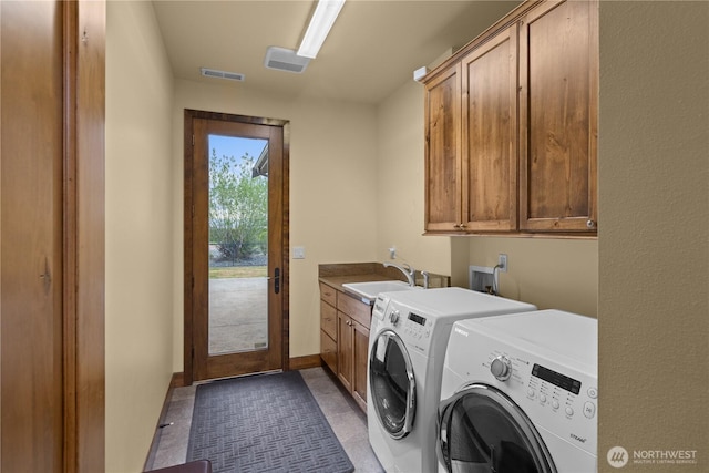 510 Lakeside Way SW, Mattawa, WA 99349 - washroom with cabinet space, washer and clothes dryer, and baseboards