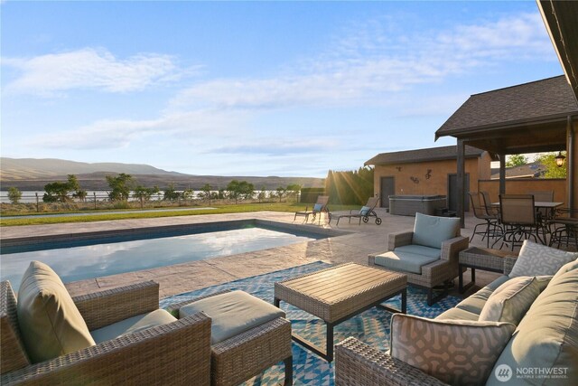 510 Lakeside Way SW, Mattawa, WA 99349 - swimming pool featuring a mountain view, outdoor lounge area, and a patio
